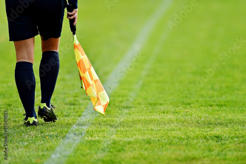 Assistant referee on soccer field photo