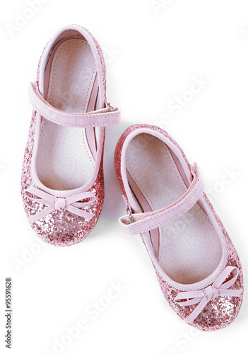 Shiny pink girls shoes isolated on white background