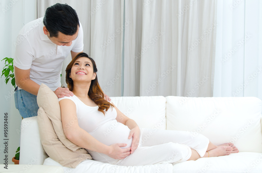 Asian man and his pregnant wife Asian man and his pregnant wife