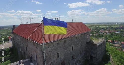 The Palanok Castle in Mukachevo,Ukraine. Yearly over 100 000 travelers from all over the world come here in order to see this unique sample of fortification architecture photo