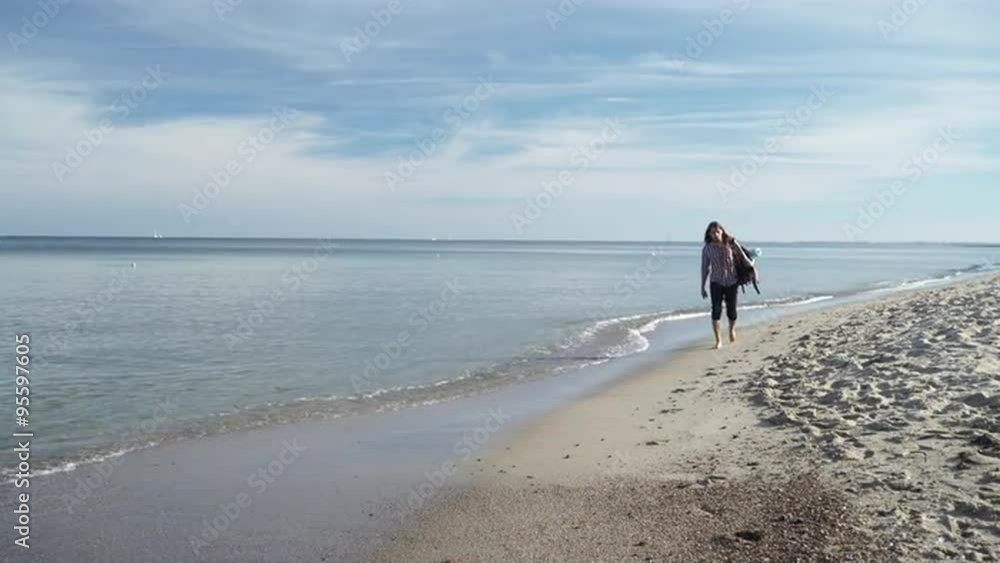 Man hiker with backpack tramping by seaside 4K Man hiker with backpack tramping by seaside 4K