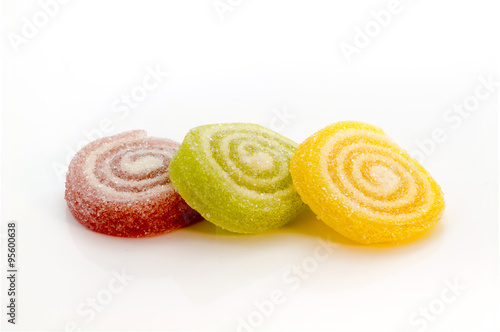 Colorful Gummy sweets spiral stacking focus isolated on white background