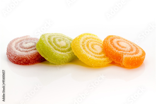 Colorful Gummy sweets spiral stacking focus isolated on white background