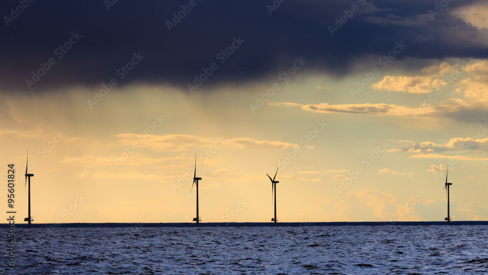 wind turbines power generator farm along coast sea