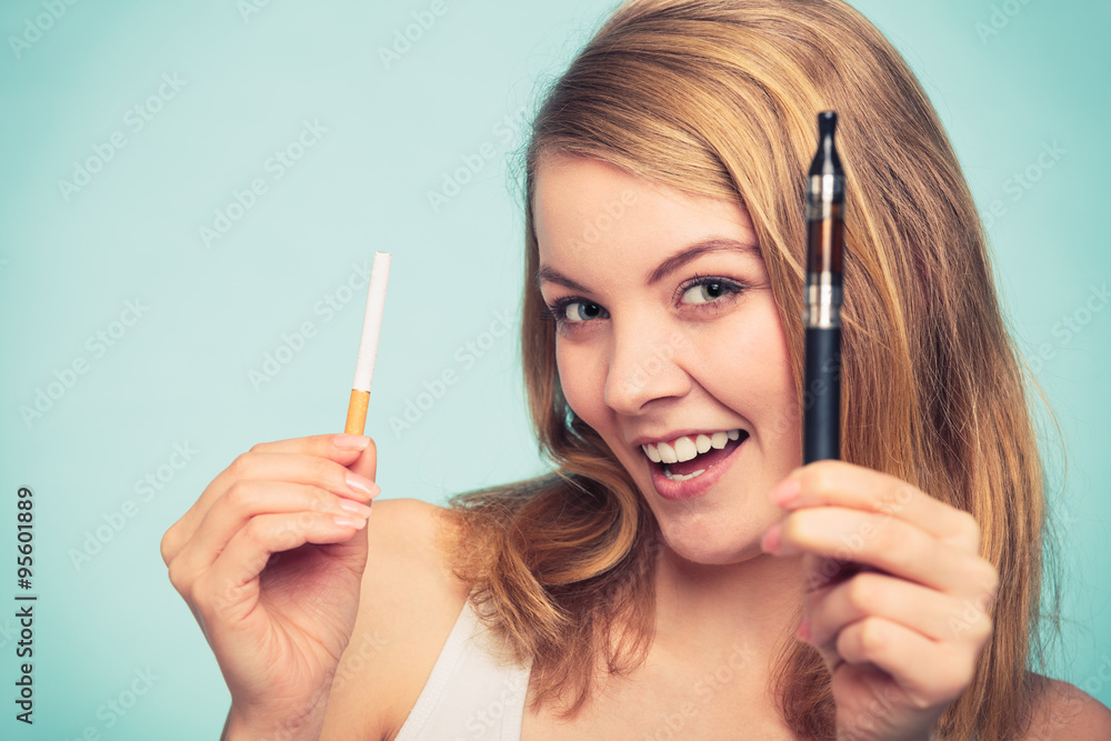 Obraz premium Girl with normal and electronic cigarette.