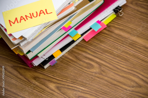Manual; The Pile of Business Documents on the Desk