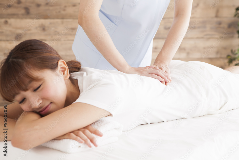 Women are receiving comfortably back massage Women are receiving comfortably back massage