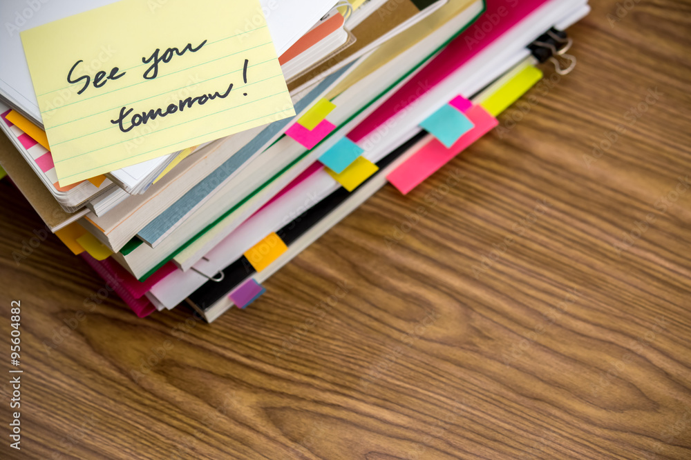 Obraz premium See You Tomorrow; The Pile of Business Documents on the Desk