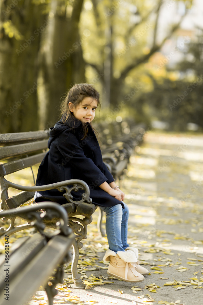 Little girl on the bench Little girl on the bench