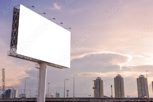 large blank billboard on building in city view background