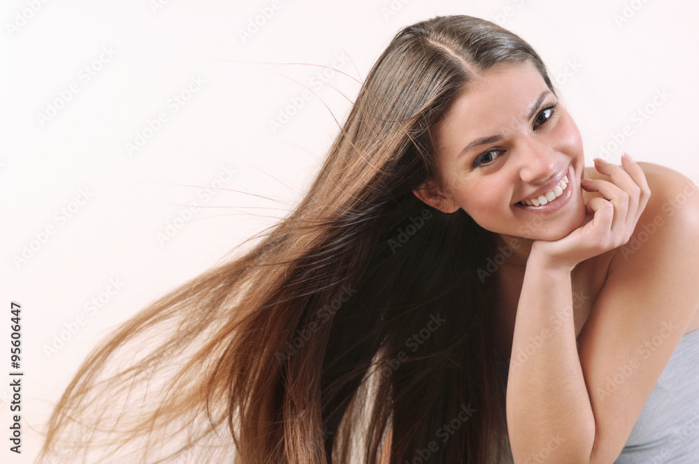 Fototapeta premium happy smiling woman with windy bright hair