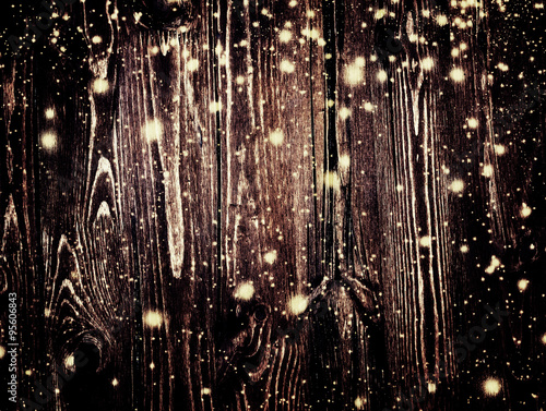 Dark brown wood texture with white snow and stars in vintage sty