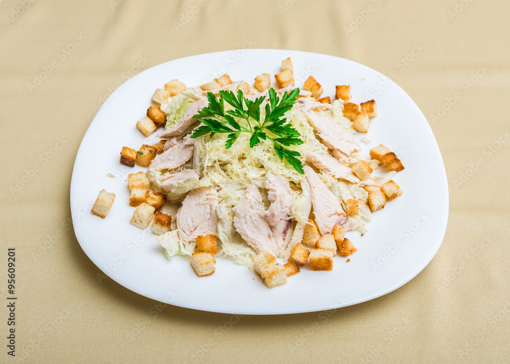 Chicken cheese croutons cabbage salad (focus is in the middle of the dish) Chicken cheese croutons cabbage salad (focus is in the middle of the dish)