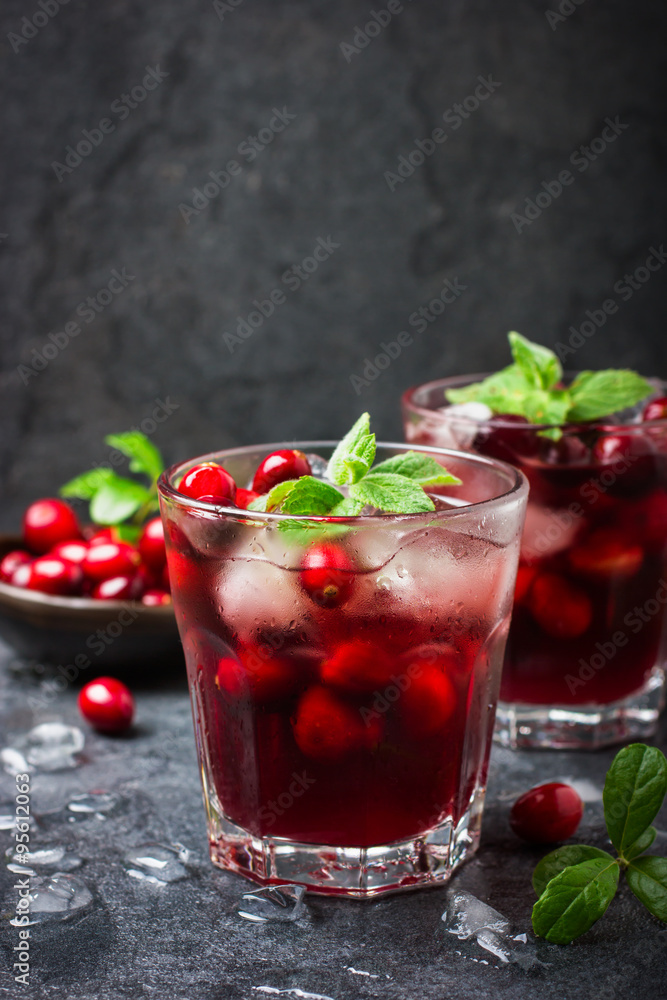 refreshing cocktail with cranberry and ice, selective focus refreshing cocktail with cranberry and ice, selective focus