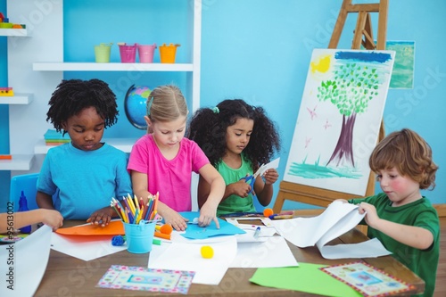 Happy kids doing arts and crafts together