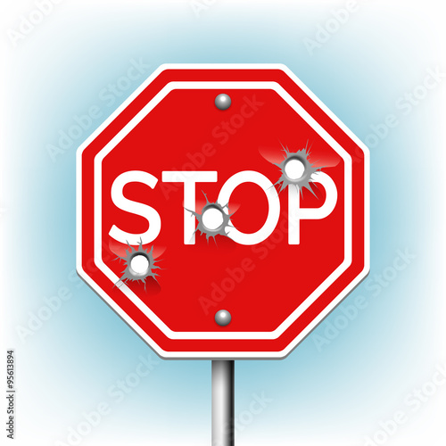 Stop sign with bullet holes