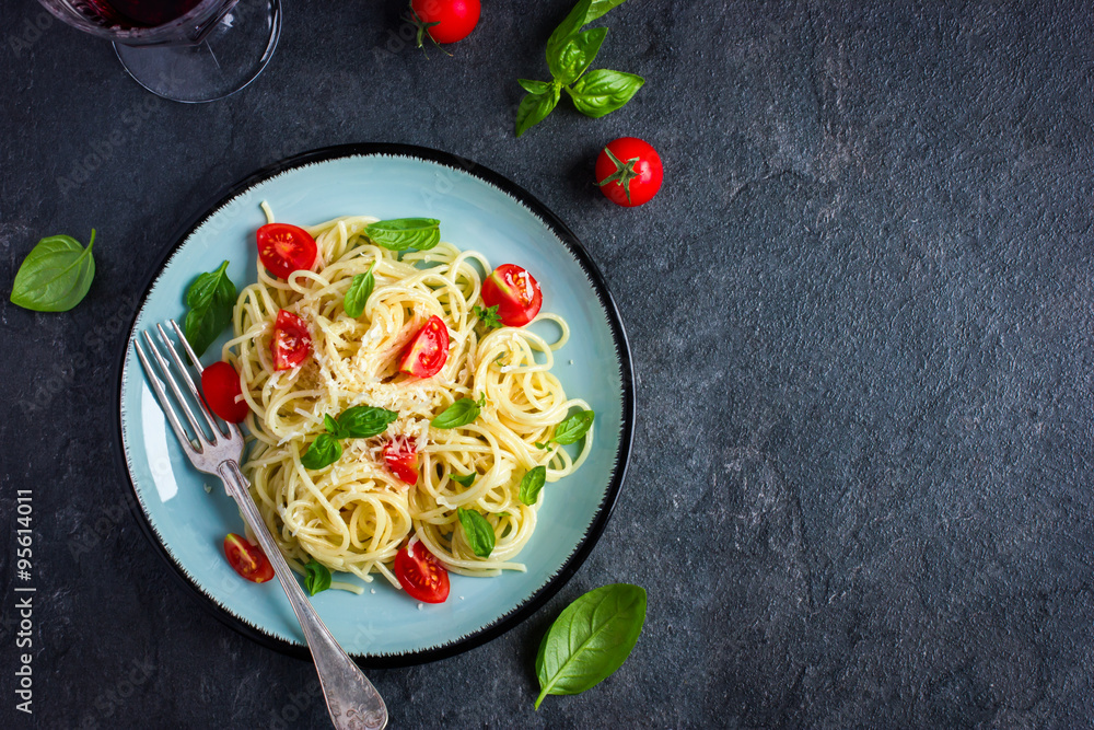Spaghetti pasta  with cherry tomatoes,  basil and parmesan chees