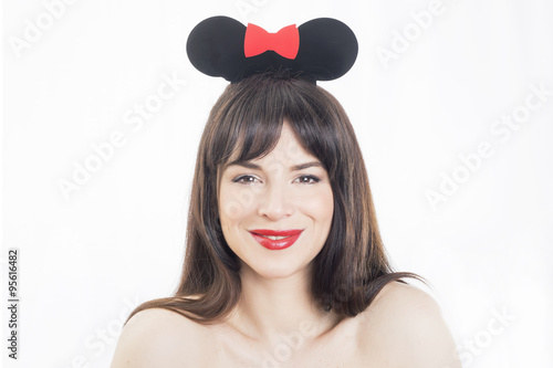 Fotografi Beautiful girl smiling wearing mouse ears accessory