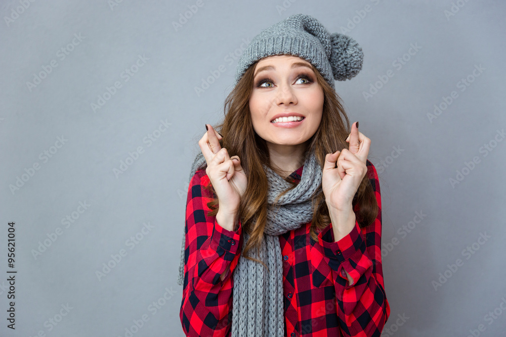Beautiful woman praying with crossed fingers Beautiful woman praying with crossed fingers