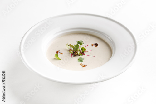 Closeup of a plate of mushroom cream soup.