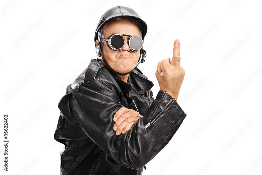Angry senior biker showing a middle finger Angry senior biker showing a middle finger