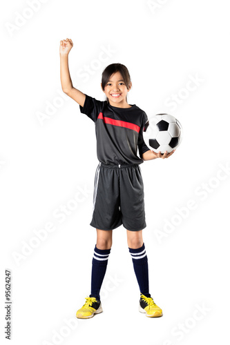 Young asian girl holding soccer ball and hand up, Isolated over white