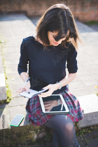 young pretty woman writing