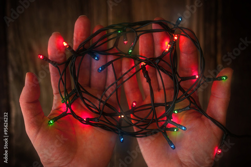 Wallpaper Mural Сolorful festoon in the hands  horizontal Torontodigital.ca