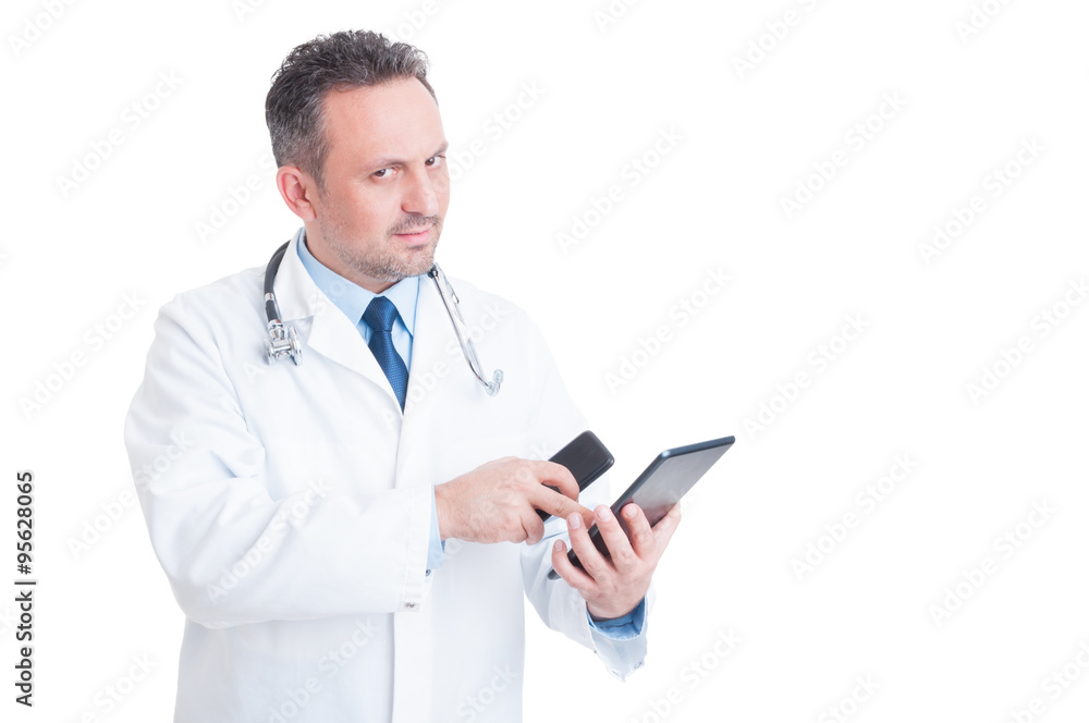Smart and modern medic or doctor using tablet and phone Smart and modern medic or doctor using tablet and phone