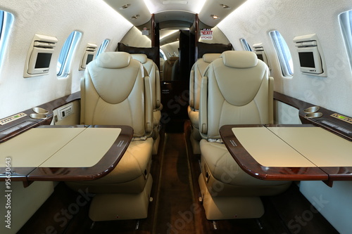 business jet cabin with tables open