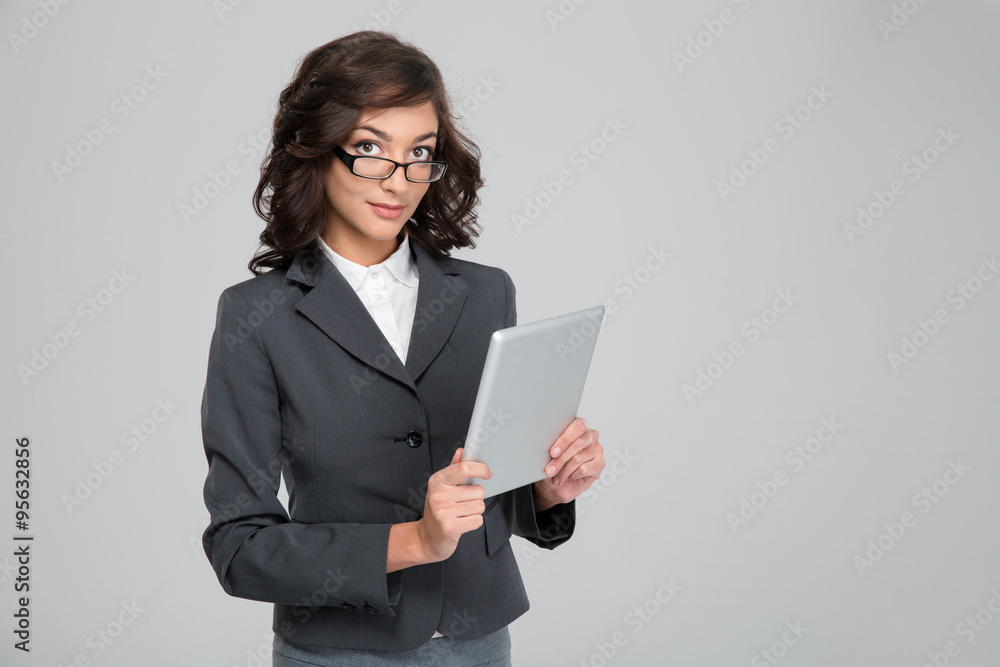 Young business woman in glases using tablet Young business woman in glases using tablet