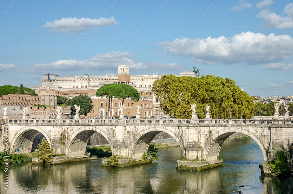 Historic Landmark architecture Eliyev build a bridge to the Castel Sant'Angelo in Rome, on the banks of the Tiber River near the arched bridge across the river on a bright sunny day