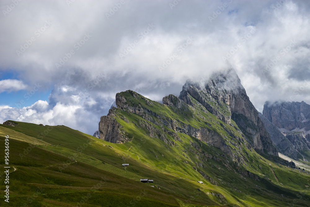 Fototapeta premium Seceda peak with clouds, Odle mountain range, Gardena Valley, Do