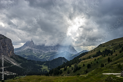 Sassolungo (Langkofel) under the clouds with a ray of light on G