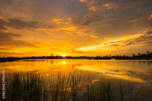 Wonderful sunset landscape over the calm lake