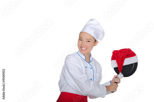 fun asian chef with frying pan and Christmas hat