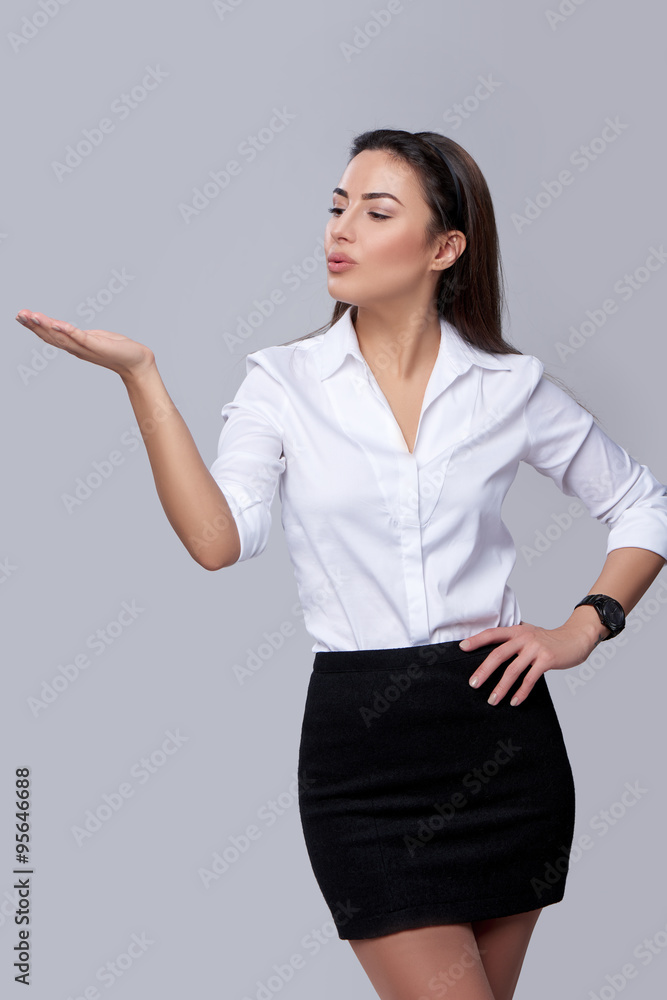 business woman blowing on palm business woman blowing on palm