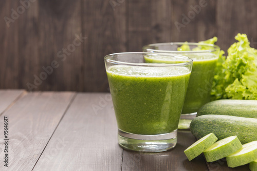 Healthy green vegetables smoothie on rustic wood table