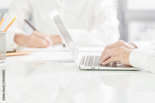 Businessman analyzing investment charts with laptop. Accounting