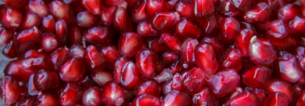 Pomegranate seeds, juicy fruit in a glass container. Pomegranate seeds, juicy fruit in a glass container.