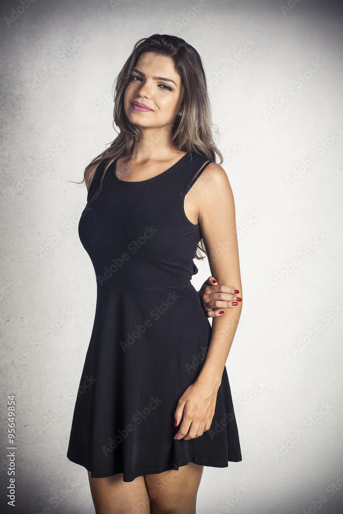 Attractive model posing in a black dress Attractive model posing in a black dress