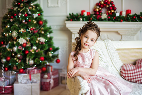 Portrait of the girl near christmas tree © Natalia Chircova