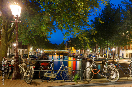 Night city view of Amsterdam canal and bridge