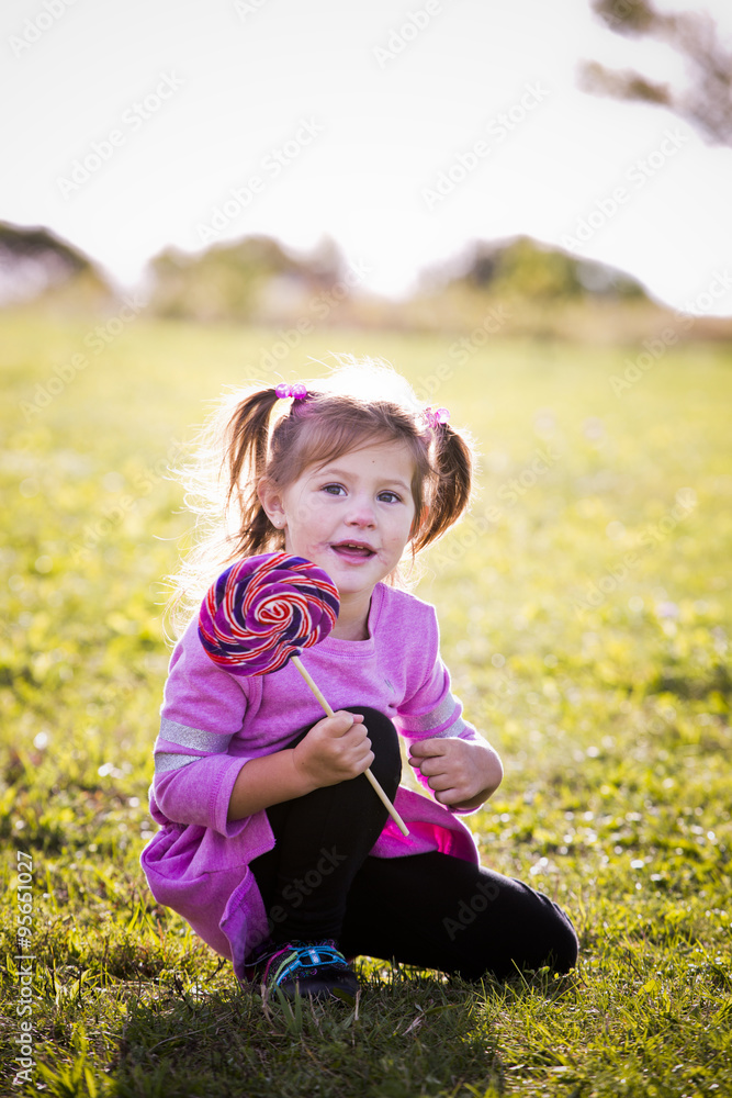 Fototapeta premium portrait of a little girl in the park