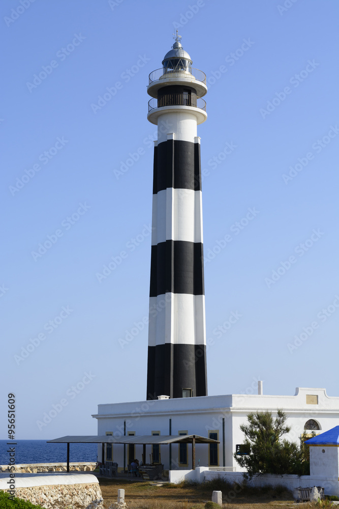 View of Menorca Cap de Artrutx Lighthouse before sunset in southwest cape at Balearic Islands, Spain View of Menorca Cap de Artrutx Lighthouse before sunset in southwest cape at Balearic Islands, Spain