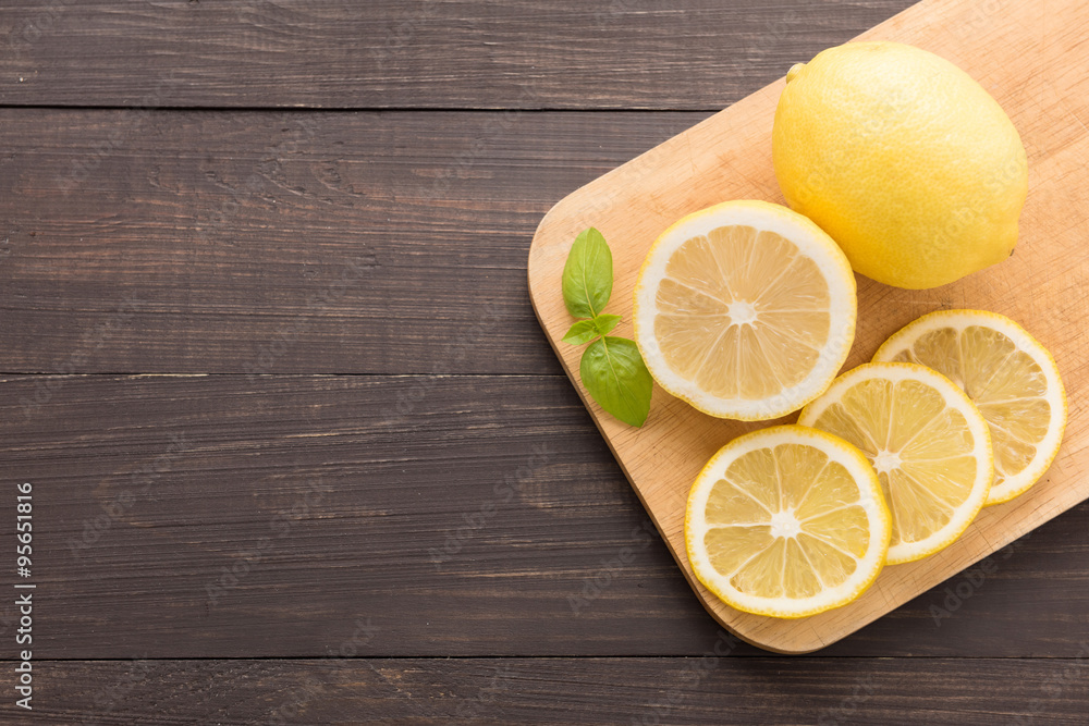 Fresh slice lemon on the wooden background Fresh slice lemon on the wooden background