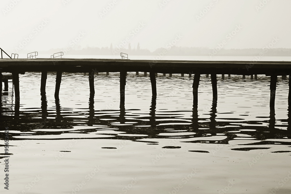 Old wooden dock . Fine art black and whie image Old wooden dock . Fine art black and whie image