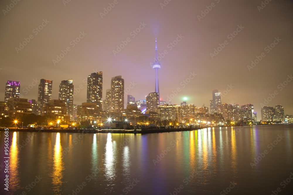 Toronto Skyline at night with a reflection in Lake Ontario