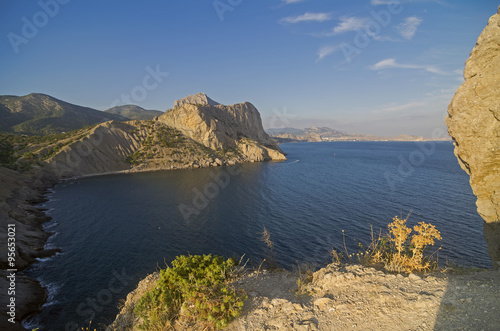 Coastal cliffs under the evening sun. Crimea.