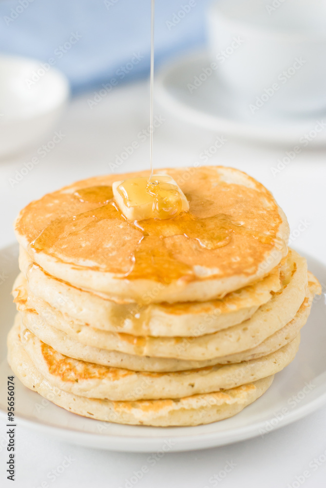 Stack of pancakes with butter and honey Stack of pancakes with butter and honey